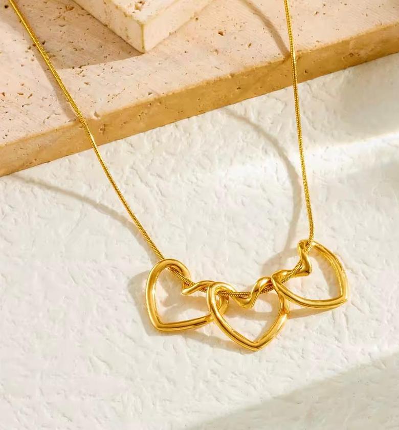 Amora Triple Heart Gold Statement Necklace image