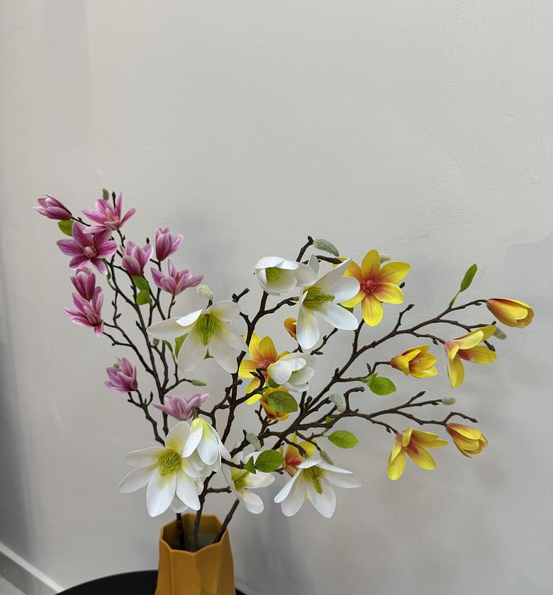 Faux blooming magnolia branches. image