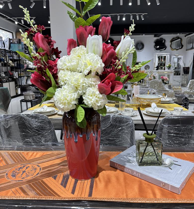 Tulips paired with hydrangeas in a red vase image